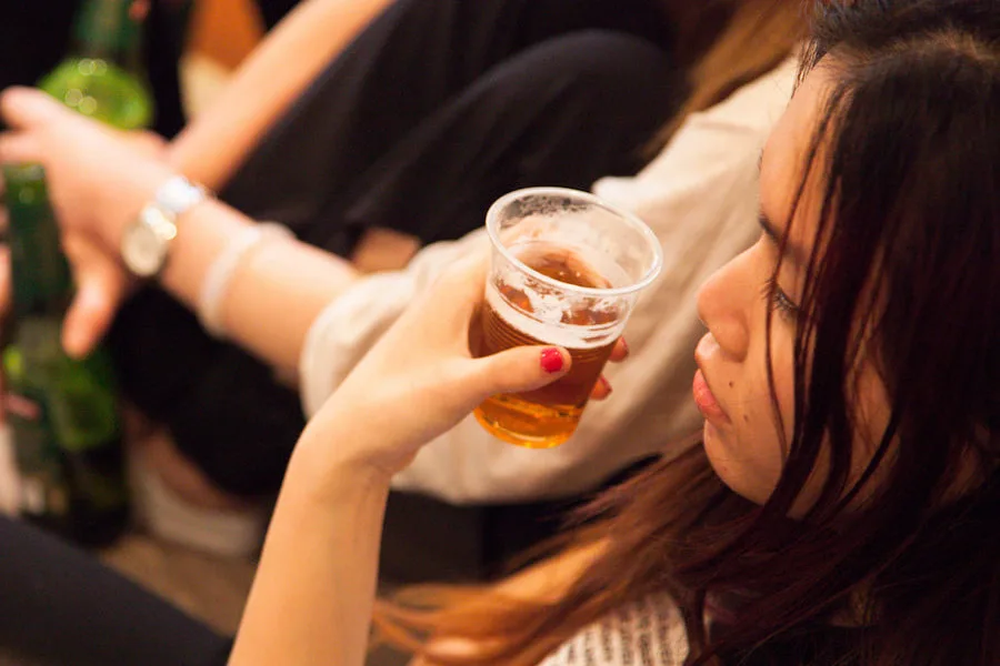 teen girl drinking beer