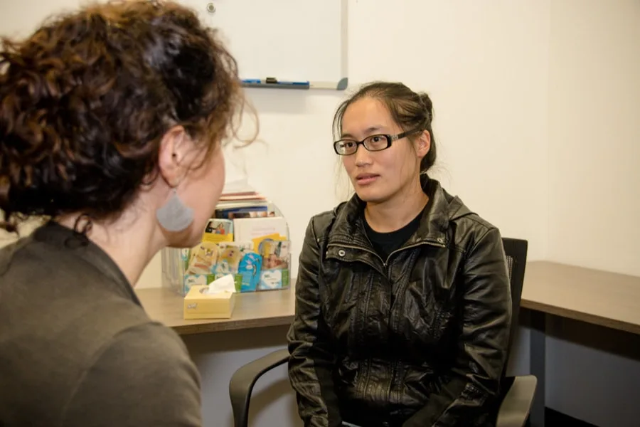 Girl looking at her counsellor