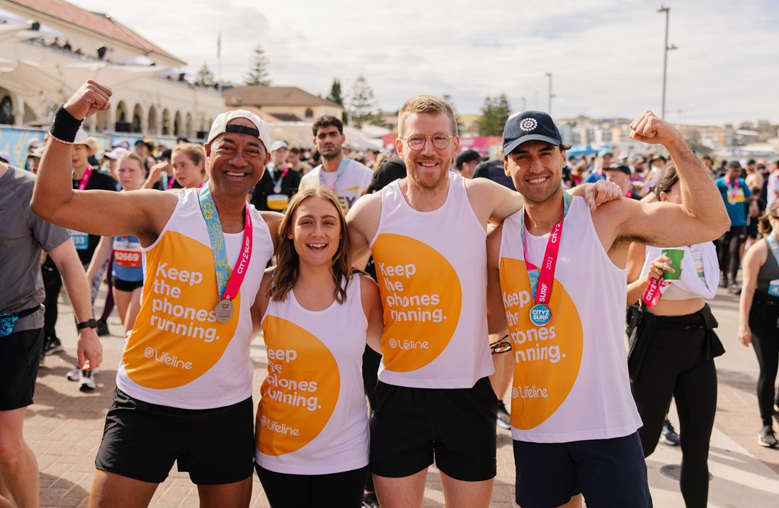 A group of runners at the ending of the yearly 'City 2 Surf' race wearing their Lifeline fundraising jerseys