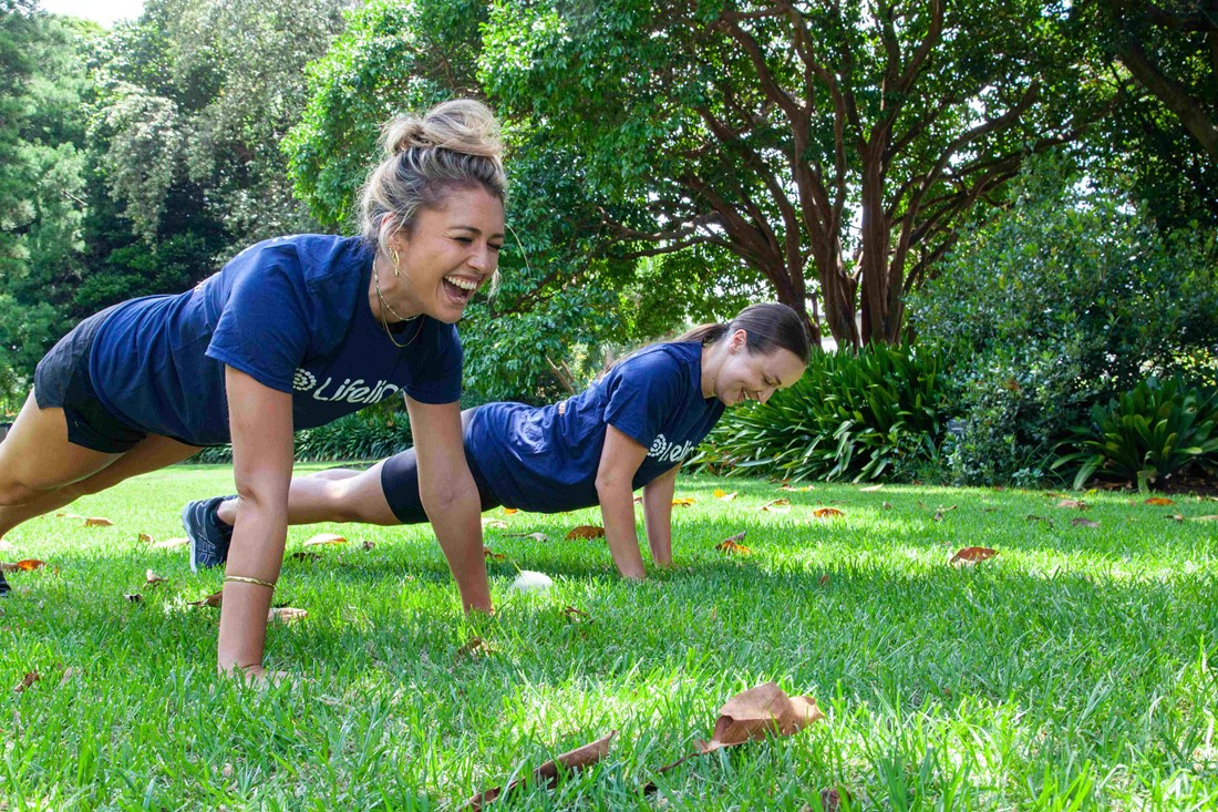 Two volunteers participating in the Lifeline push up challenge.