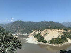 A steel bridge crossing a river in the Rudraprayag district, India. Rudraprayag is of immense significance for the pilgrims of Char Dham Yatra, as it is the junction for visiting Badrinath and Kedarnath Dham.
