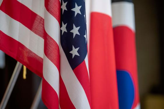 Flags representing the United States, Japan and the Republic of Korea